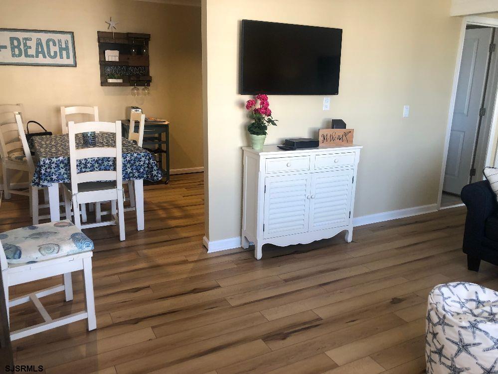 107 East Brigantine Avenue, Unit 211 Brigantine, NJ 08203 - Photo 20 of 34 a living room with wooden floor and furniture
