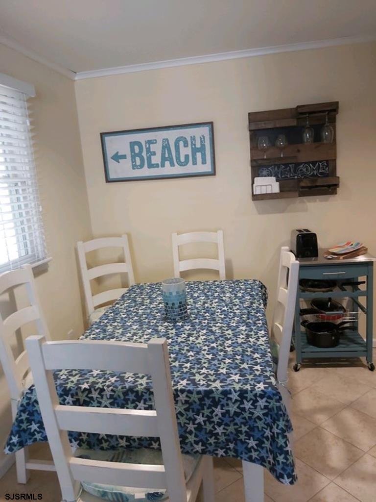 107 East Brigantine Avenue, Unit 211 Brigantine, NJ 08203 - Photo 24 of 34 a bedroom with a bed and a window