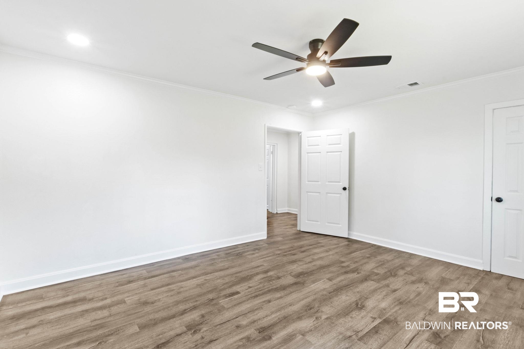 618 Pine Street Saraland, AL 36571 - Photo 21 of 41 Unfurnished bedroom with ornamental molding, wood finished floors, ceiling fan, and recessed lighting