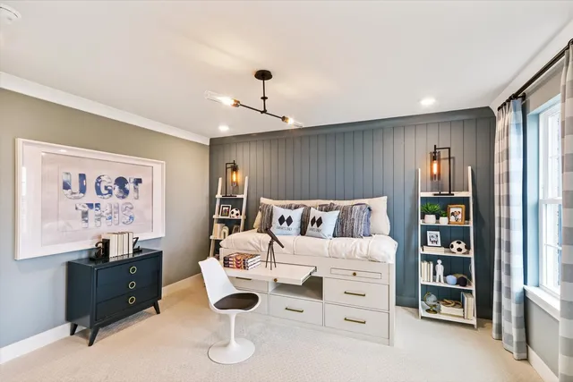 a spacious bedroom with a bed and a bookshelf