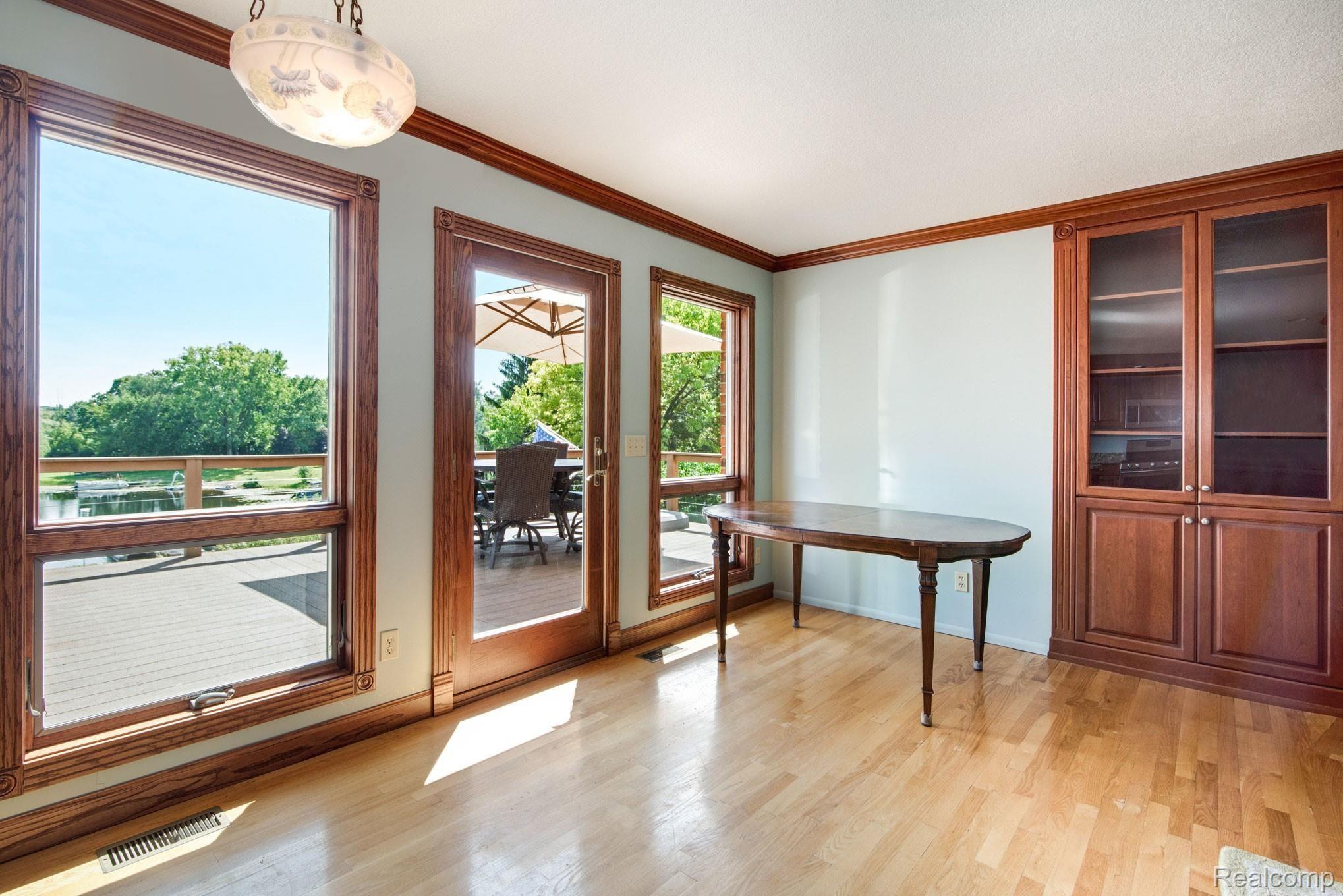 1231 Crooked Lake Road Fenton, MI 48430 - Photo 12 of 48 Beautiful use of wood flooring, trim and moulding.jpg