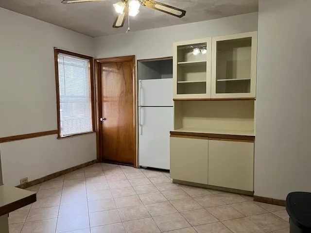 a view of an empty room with a fireplace