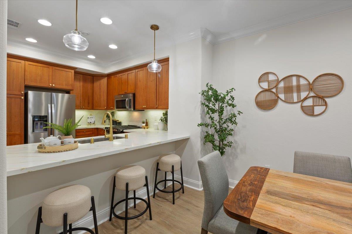 2881 Meridian Avenue, Unit 108 San Jose, CA 95124 - Photo 11 of 41 a kitchen with a table and chairs in it