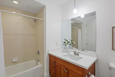 a bedroom with a bed and a view of bedroom