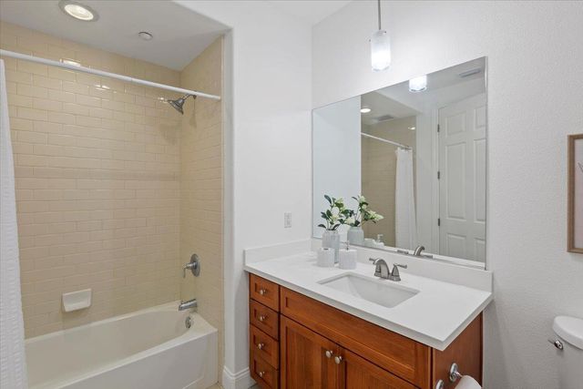 a bedroom with a bed and a view of bedroom