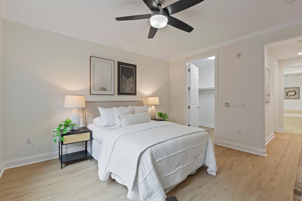 2881 Meridian Avenue, Unit 108 San Jose, CA 95124 - Photo 25 of 41 a bedroom with bed and a chandelier