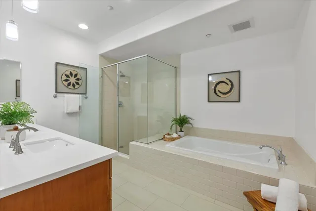 a spacious bathroom with a double vanity sink double and mirror