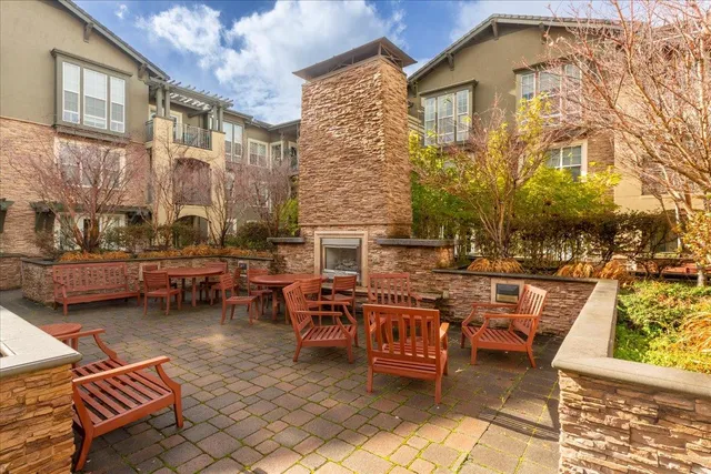 a view of a chairs and table in the patio