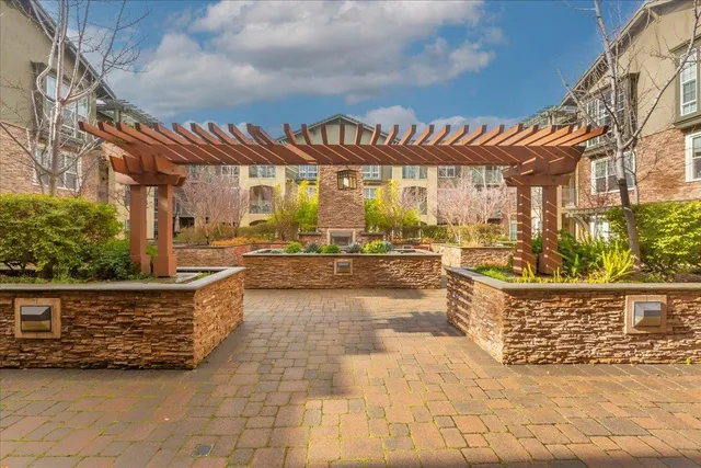 a front view of a house with outdoor seating