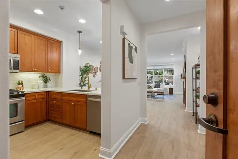 a kitchen with a sink stove and microwave