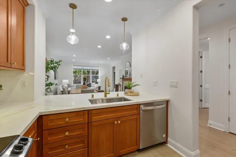 a kitchen with stainless steel appliances a refrigerator and cabinets