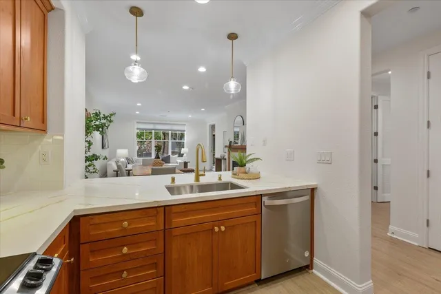 a kitchen with stainless steel appliances a refrigerator and cabinets