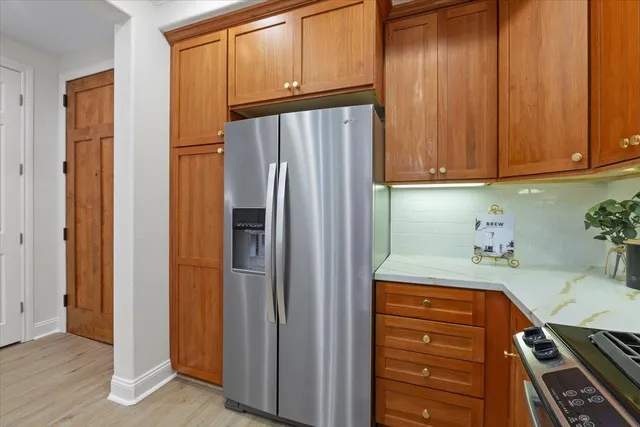 a kitchen with a table and chairs in it
