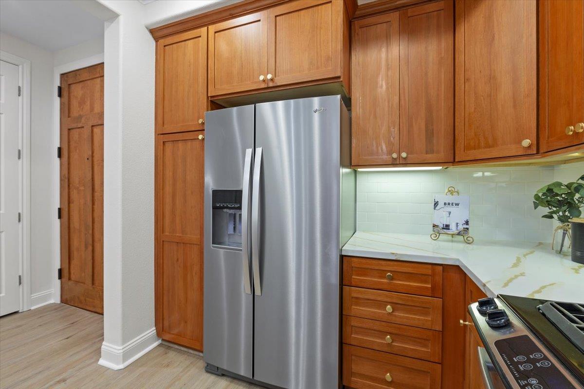 2881 Meridian Avenue, Unit 108 San Jose, CA 95124 - Photo 10 of 41 a kitchen with stainless steel appliances a refrigerator and cabinets