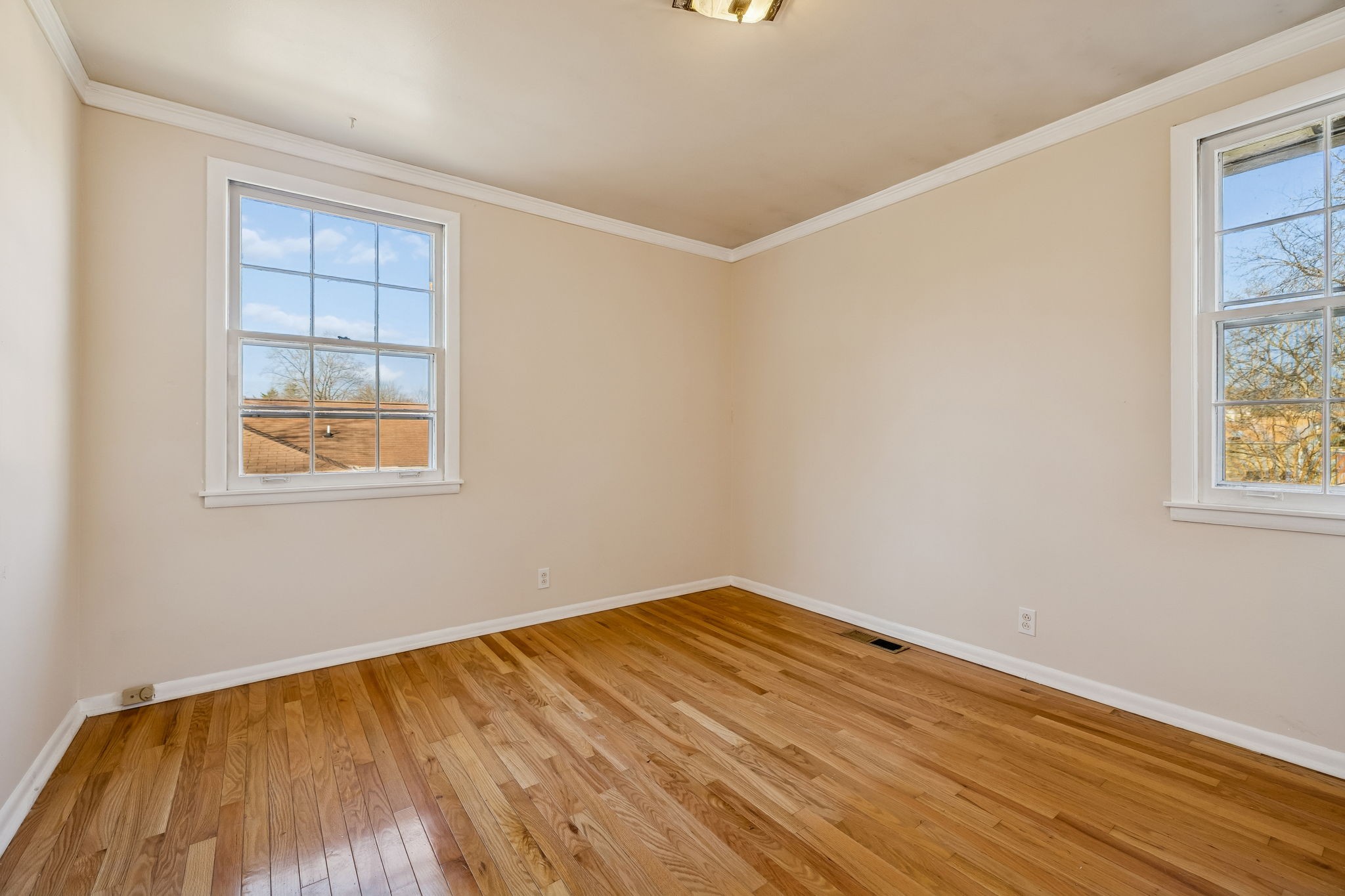 7424 George Gaines Road Nashville, TN 37221 - Photo 16 of 60 a view of empty room with wooden floor and fan