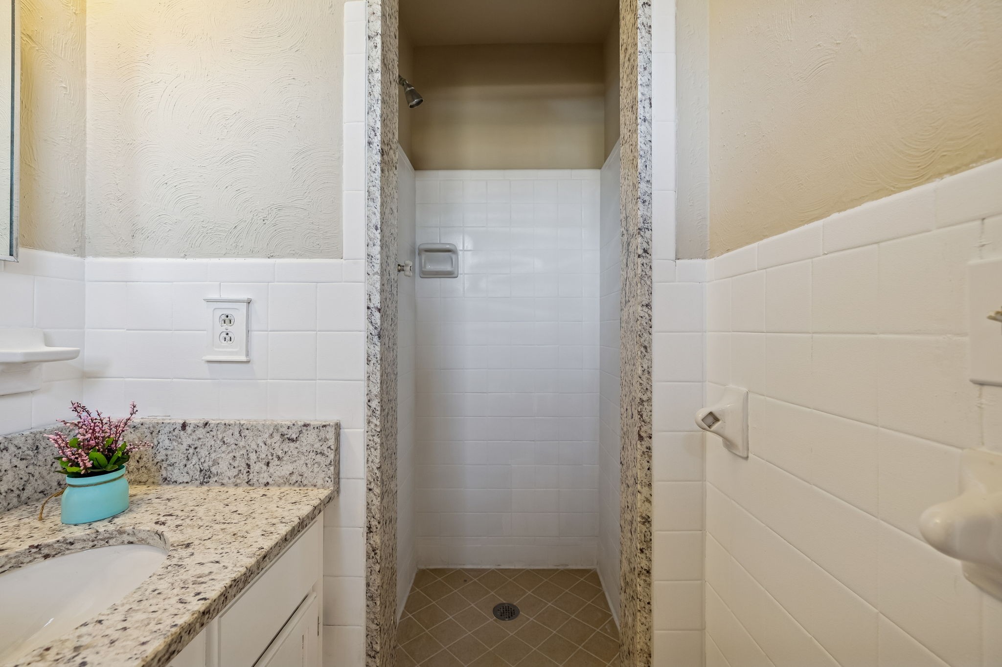 7424 George Gaines Road Nashville, TN 37221 - Photo 18 of 60 a bathroom with a granite countertop shower and a sink