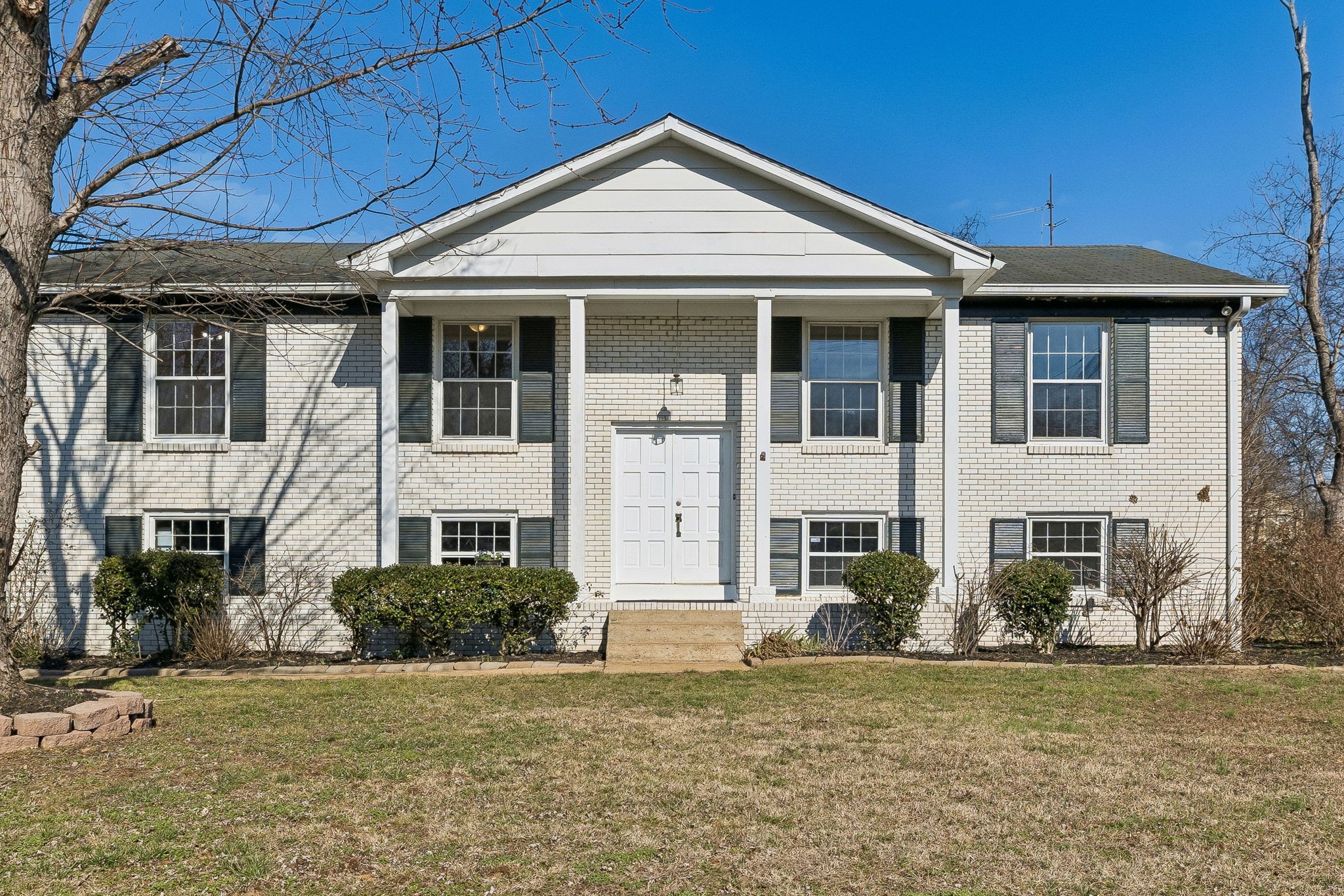 7424 George Gaines Road Nashville, TN 37221 - Photo 2 of 60 a front view of a house with a garden
