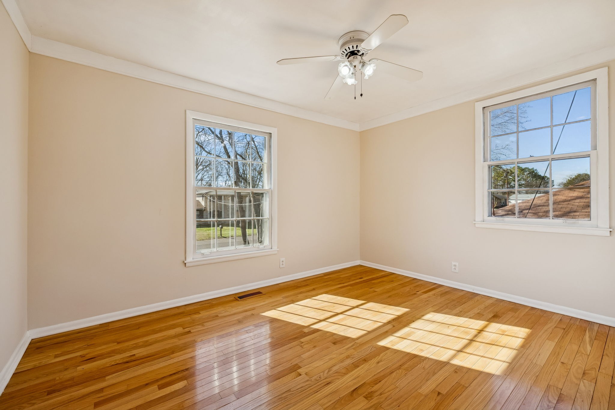 7424 George Gaines Road Nashville, TN 37221 - Photo 21 of 60 a view of an empty room with window and wooden floor