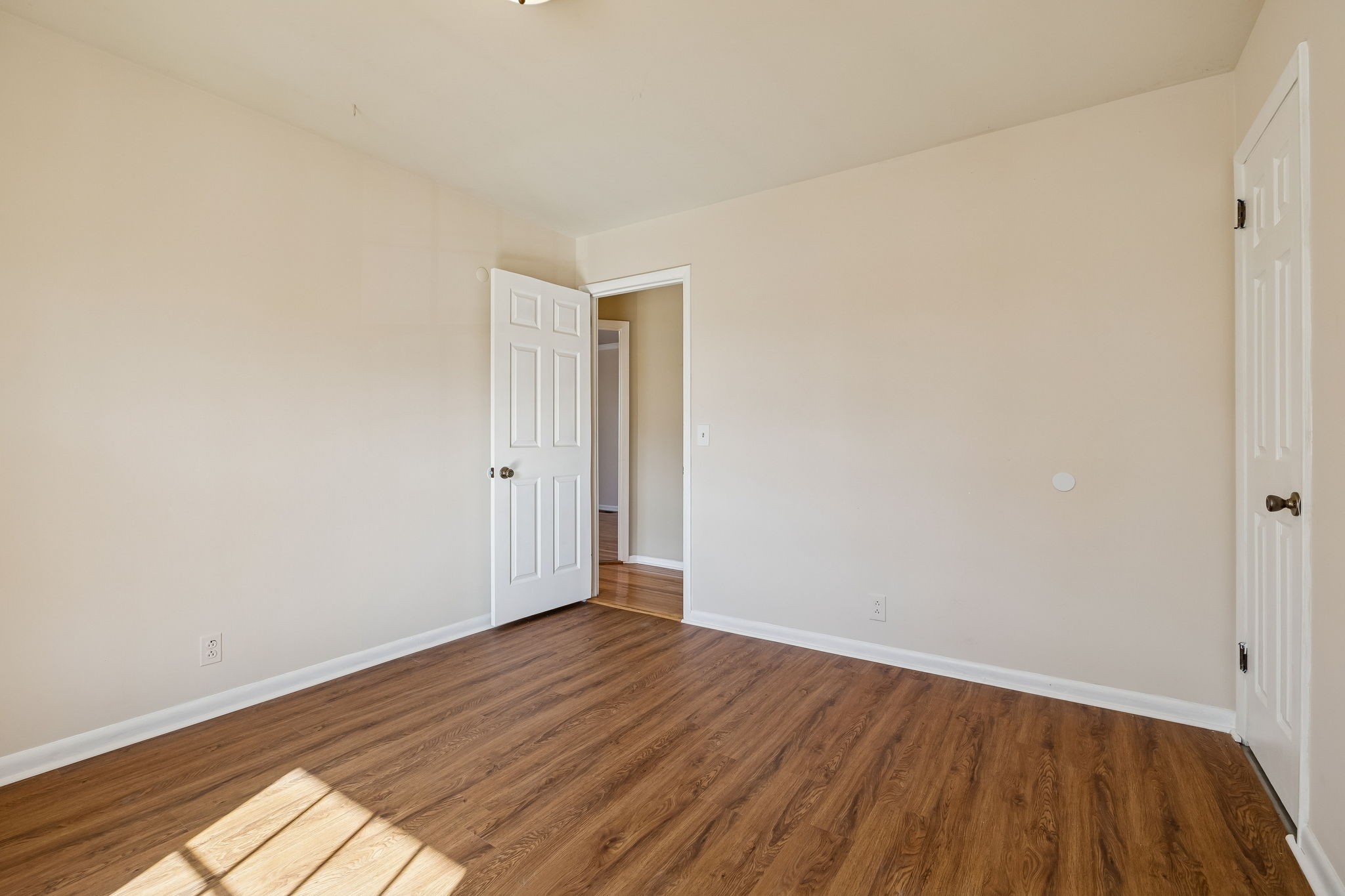 7424 George Gaines Road Nashville, TN 37221 - Photo 24 of 60 a view of an empty room with wooden floor