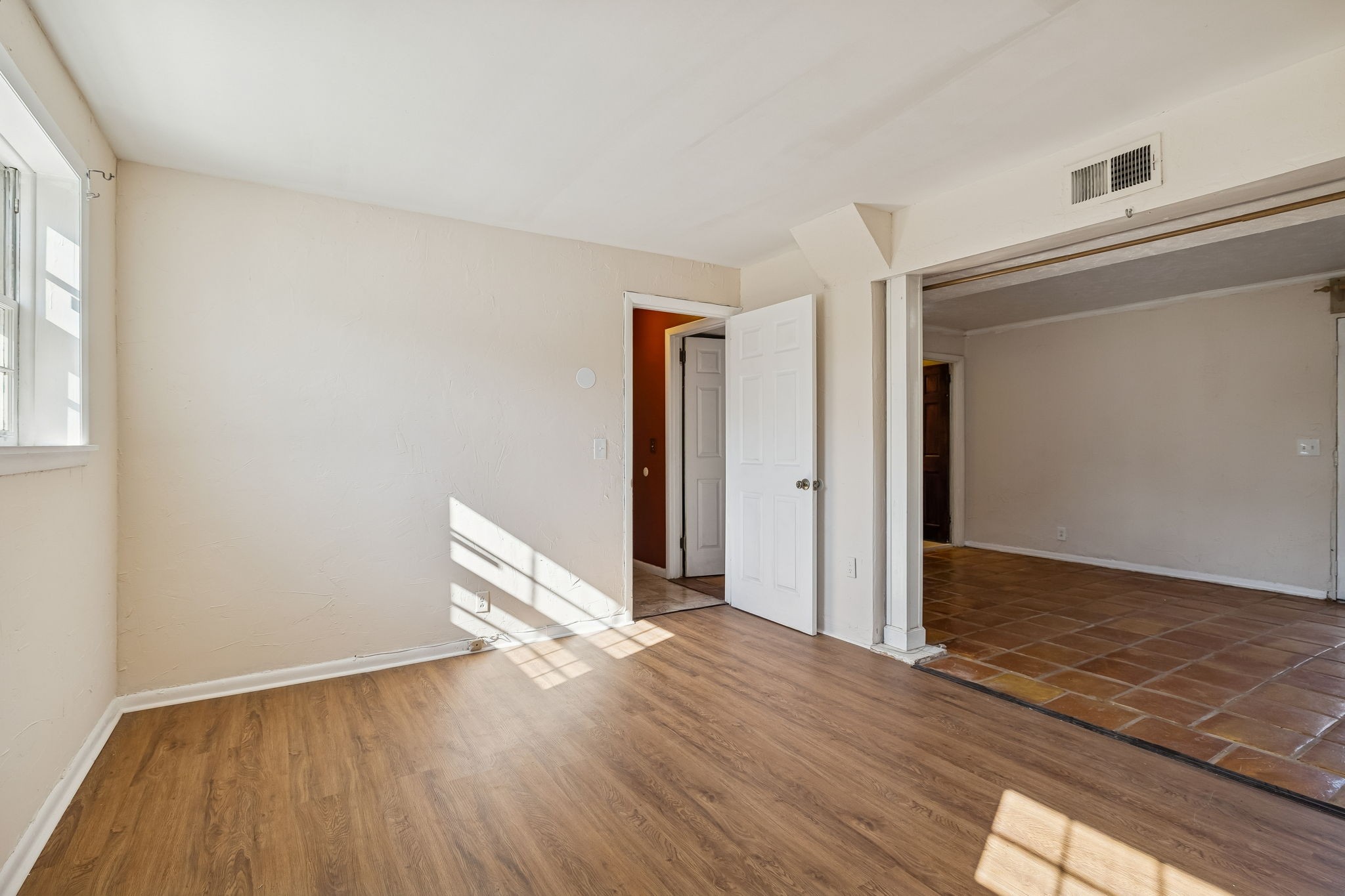7424 George Gaines Road Nashville, TN 37221 - Photo 28 of 60 an empty room with wooden floor and a window