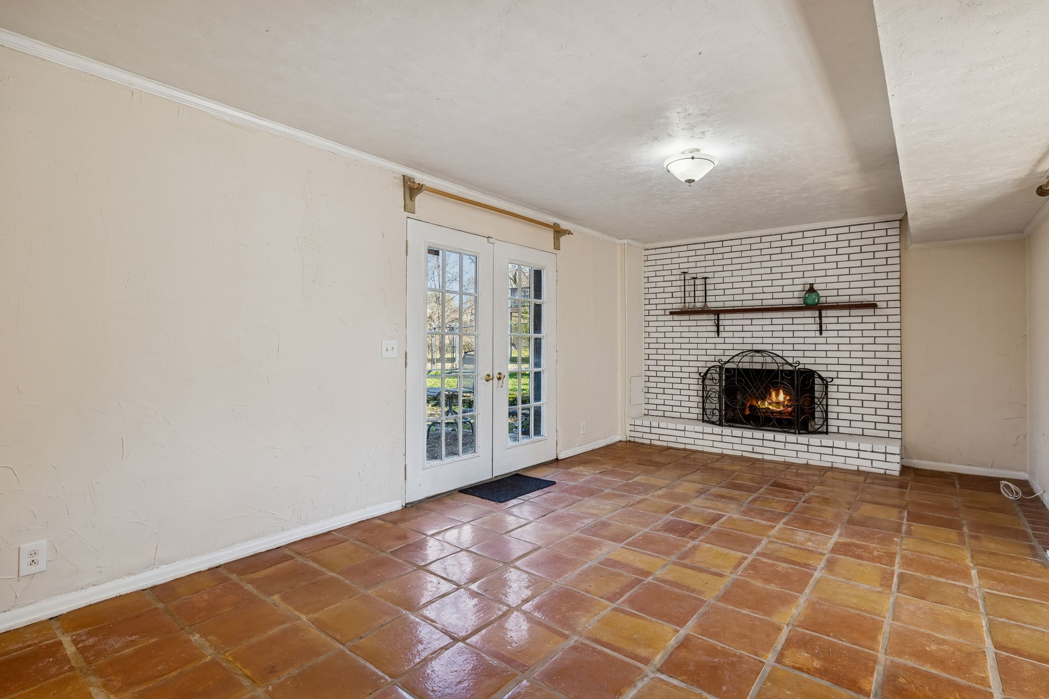 7424 George Gaines Road Nashville, TN 37221 - Photo 30 of 60 a view of an empty room with a fireplace and a window