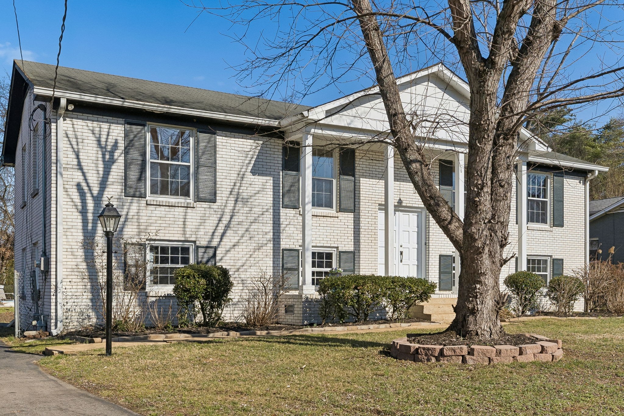 7424 George Gaines Road Nashville, TN 37221 - Photo 3 of 60 a front view of a house with a yard