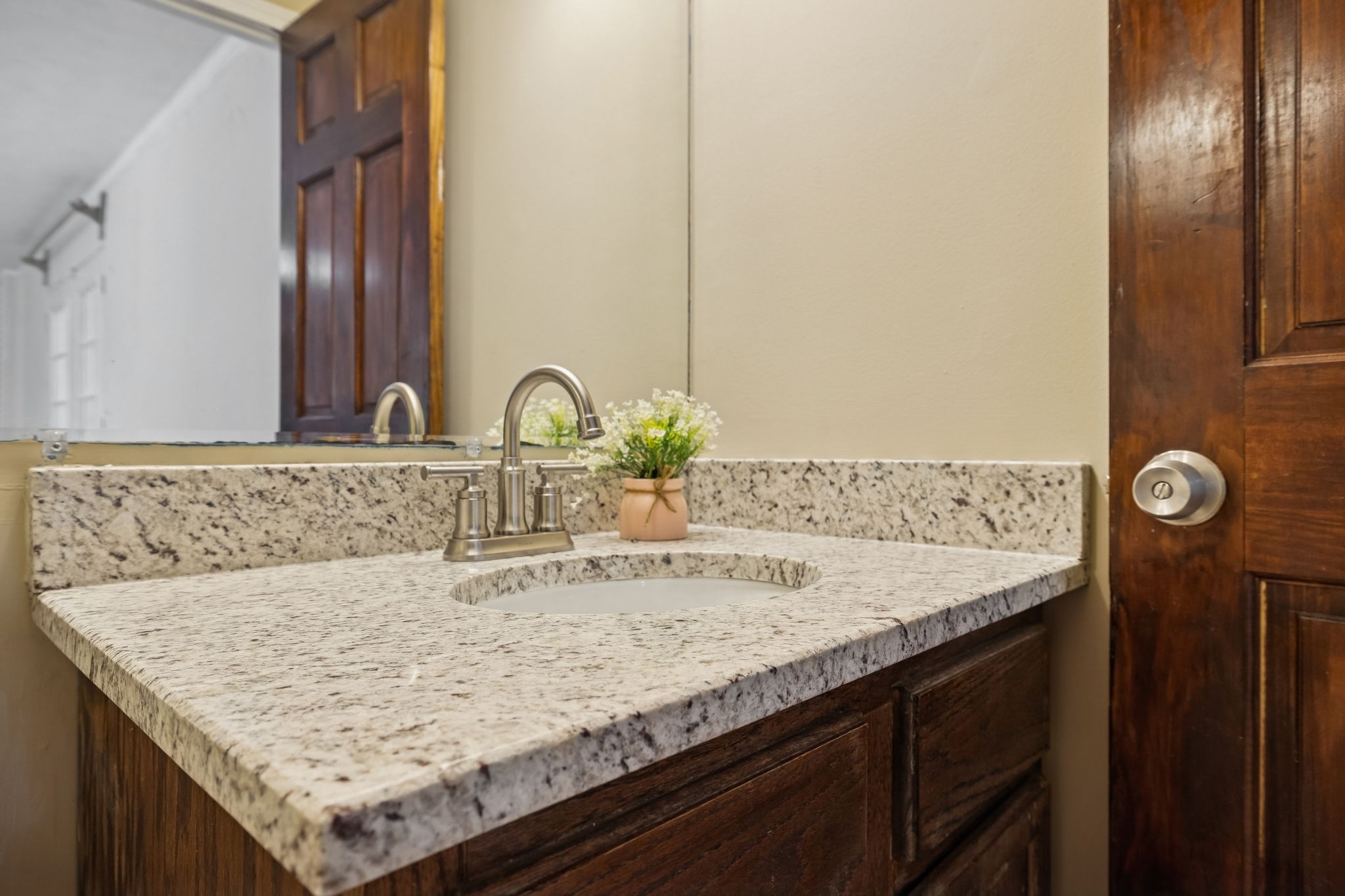 7424 George Gaines Road Nashville, TN 37221 - Photo 32 of 60 a bathroom with a granite countertop sink and a mirror