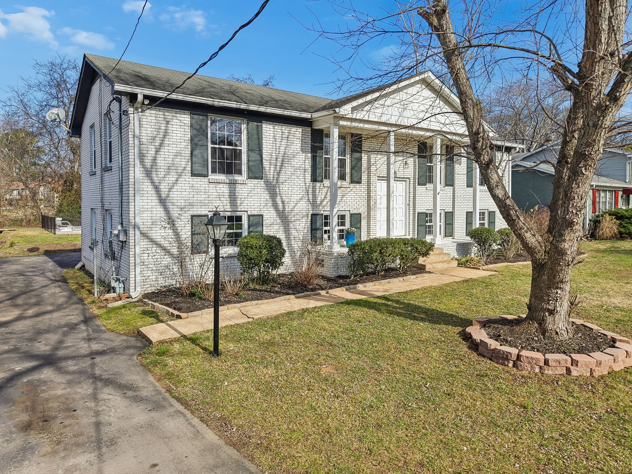 7424 George Gaines Road Nashville, TN 37221 - Photo 56 of 60 a view of a house with backyard and a tree