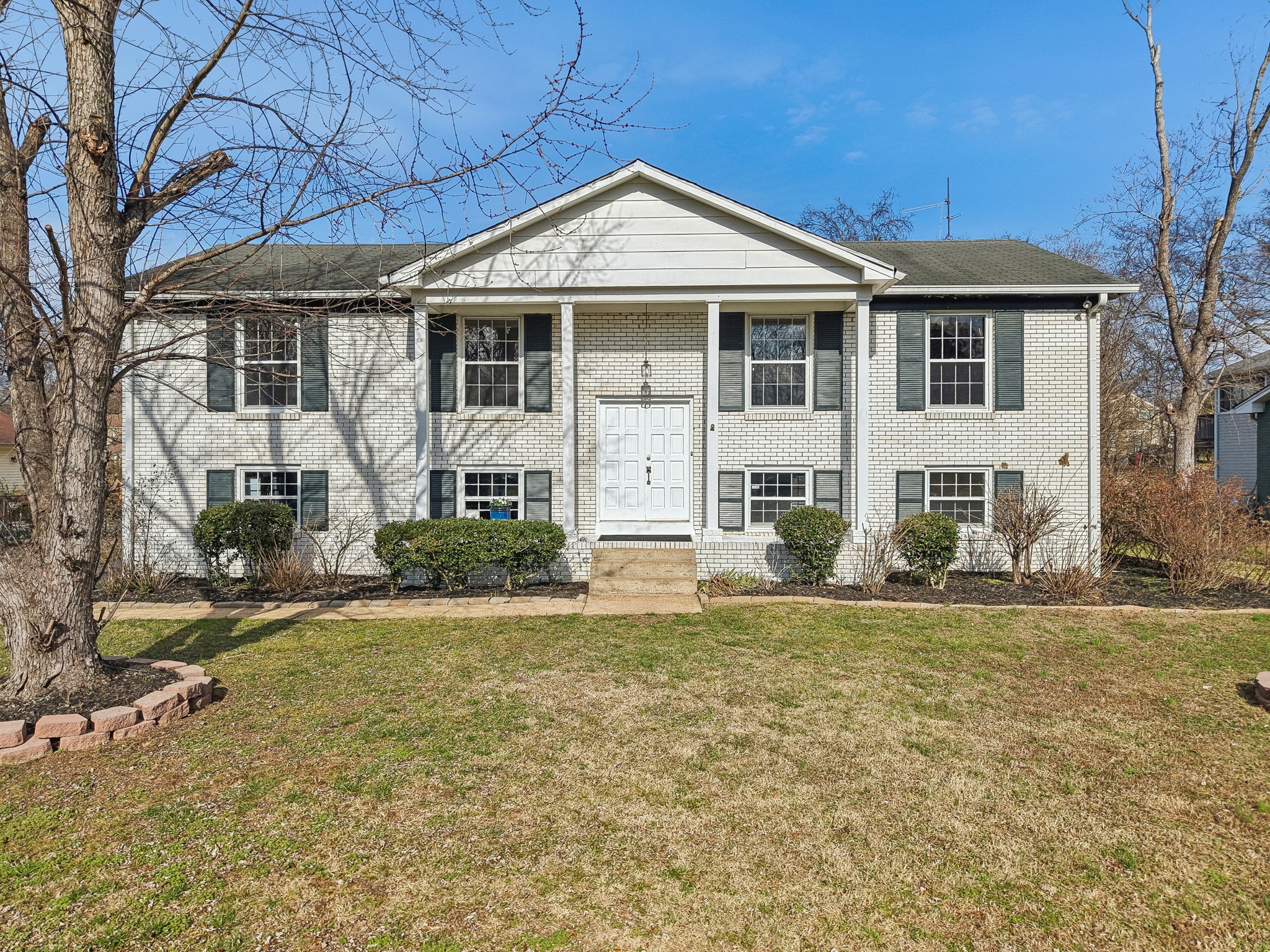 7424 George Gaines Road Nashville, TN 37221 - Photo 57 of 60 a front view of a house with a yard