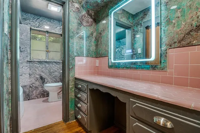 a bathroom with a sink and a mirror