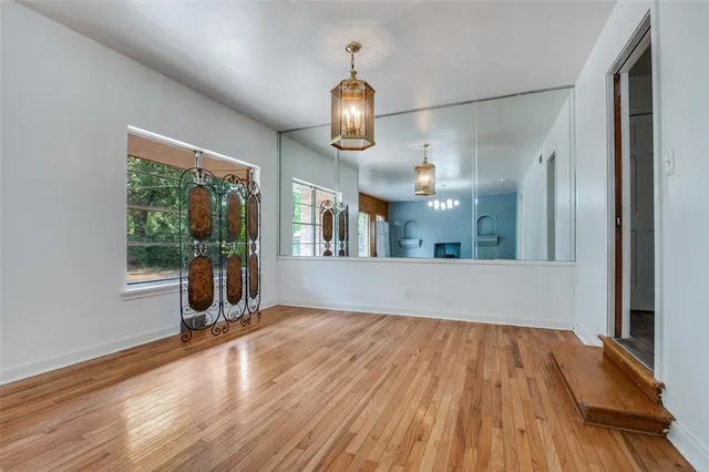 a view of livingroom with furniture wooden floor and windows