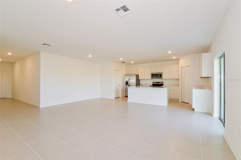 4061 Old Ml Road Haines City, FL 33844 - Photo 12 of 15 a view of kitchen with kitchen island and stainless steel appliances