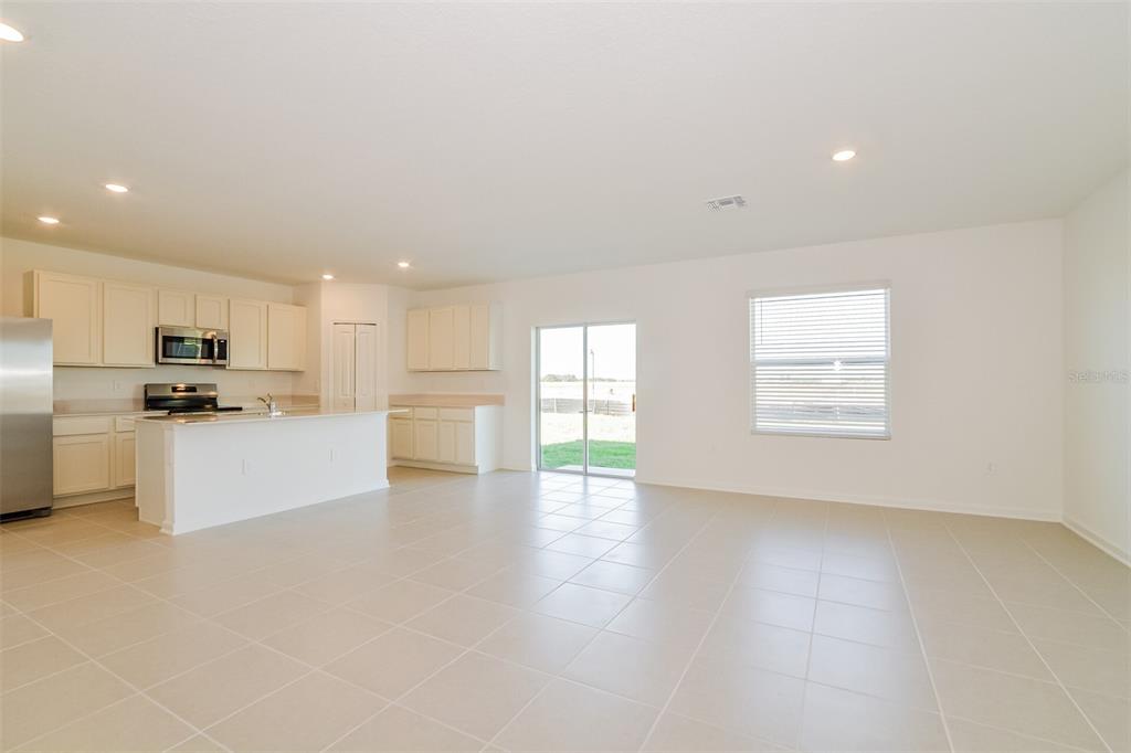 4061 Old Ml Road Haines City, FL 33844 - Photo 13 of 15 a view of kitchen with granite countertop white cabinets and stainless steel appliances