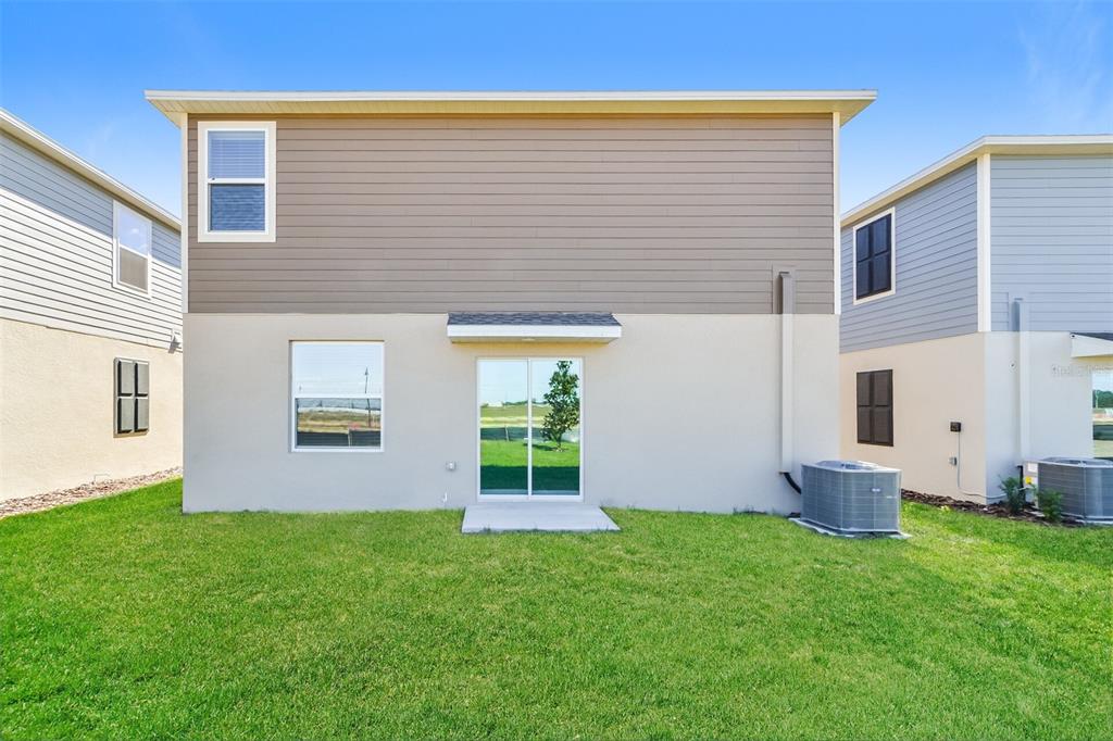 4061 Old Ml Road Haines City, FL 33844 - Photo 14 of 15 a view of house with backyard and garden