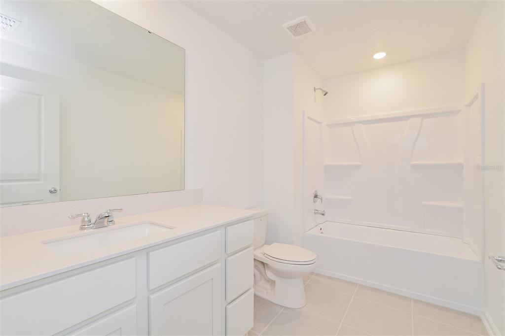 4061 Old Ml Road Haines City, FL 33844 - Photo 4 of 15 a bathroom with a sink a toilet and shower