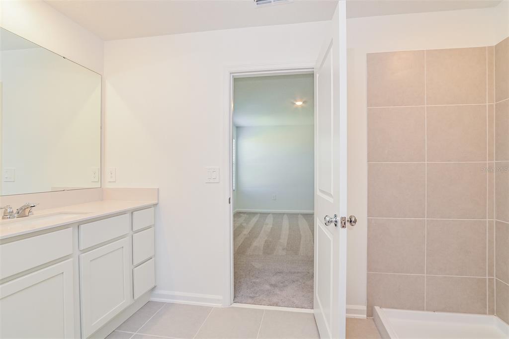 4061 Old Ml Road Haines City, FL 33844 - Photo 7 of 15 a bathroom with a shower sink and mirror