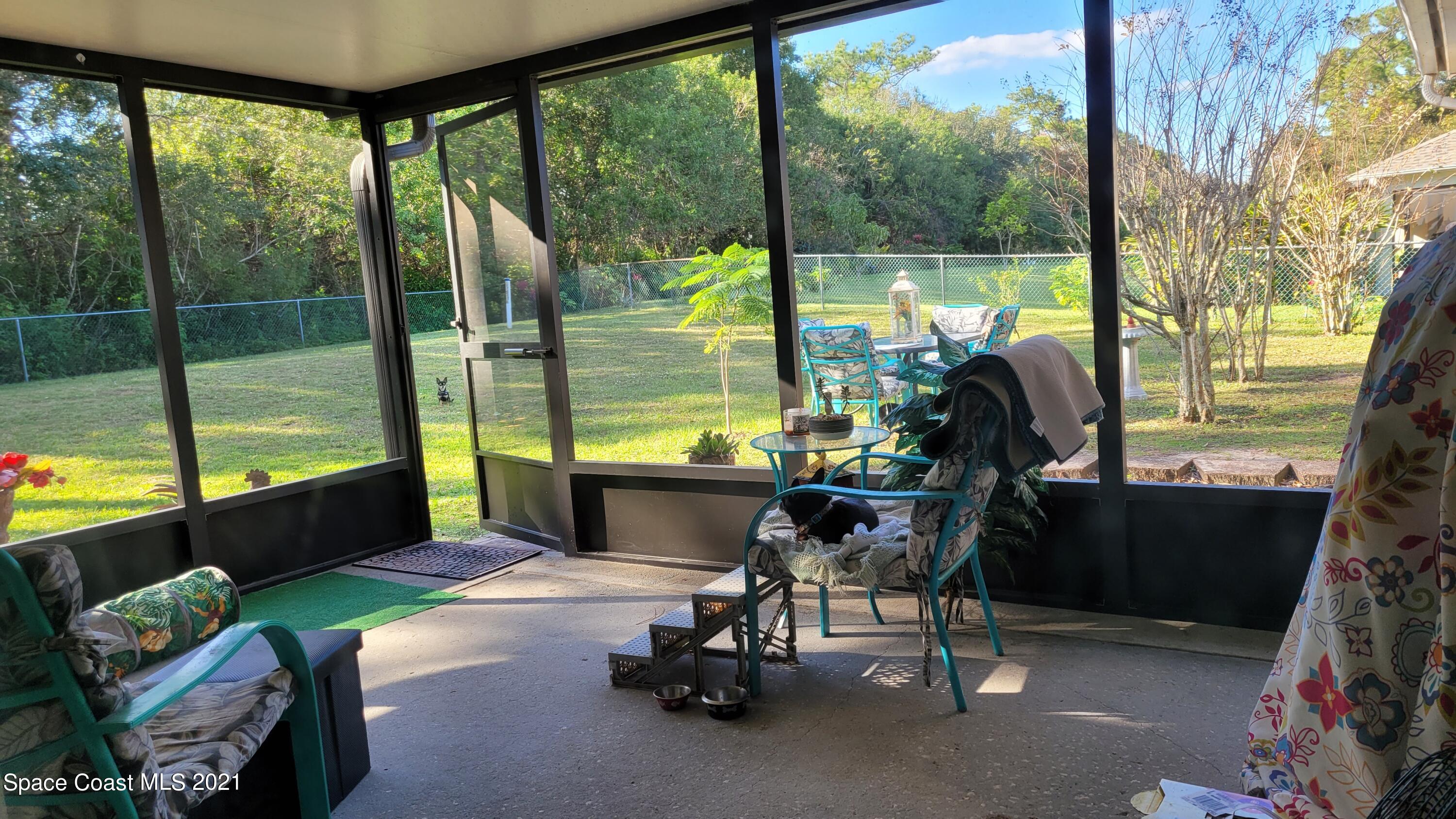1050 Meadowbrook Road Northeast Palm Bay, FL 32905 - Photo 15 of 16 screen porch