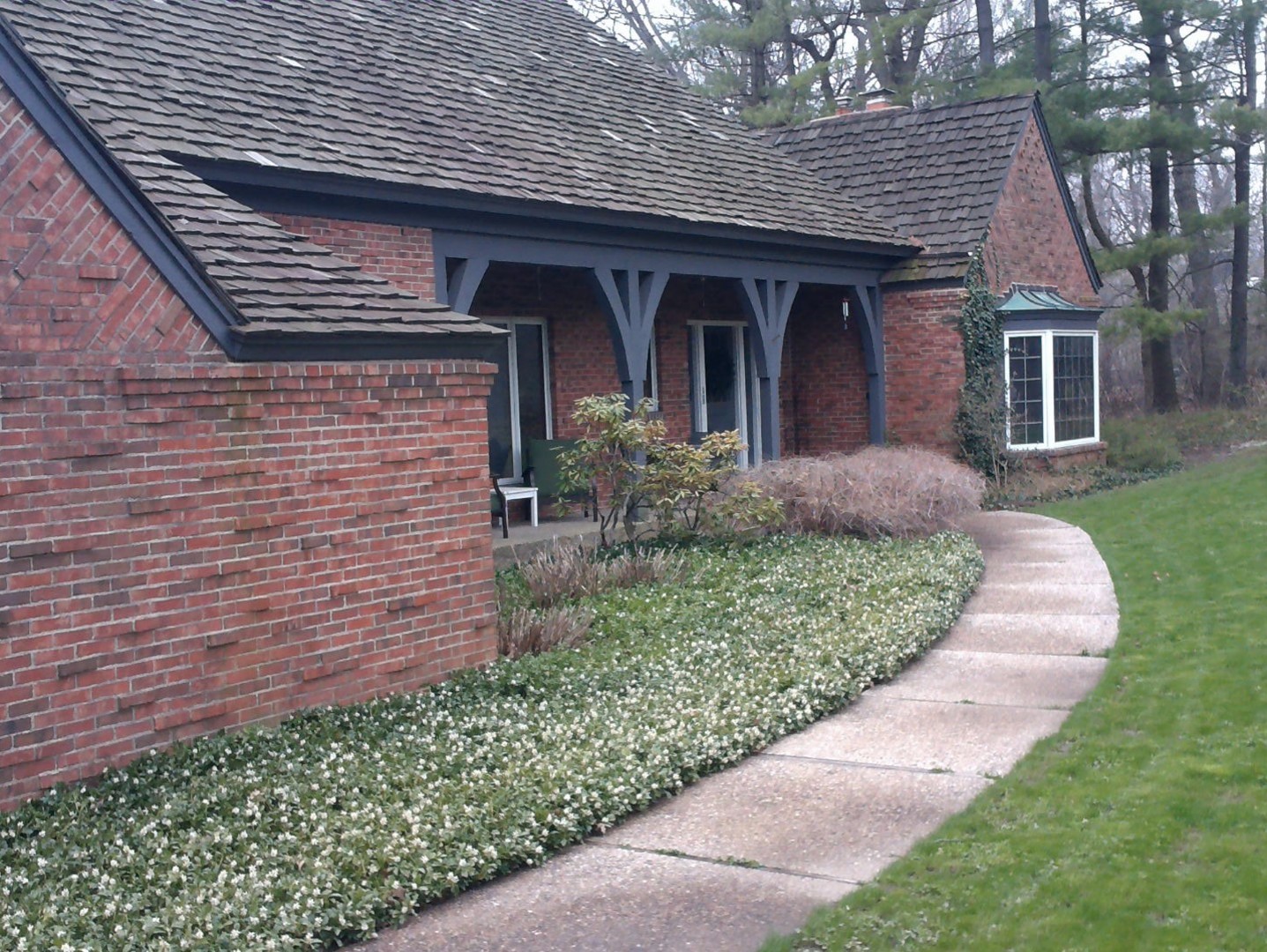 1201 Turicum Road Lake Forest, IL 60045 - Photo 1 of 20 a front view of a house with garden