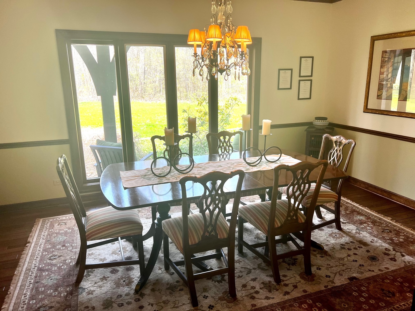 1201 Turicum Road Lake Forest, IL 60045 - Photo 8 of 20 a view of a dining room with furniture large windows and wooden floor