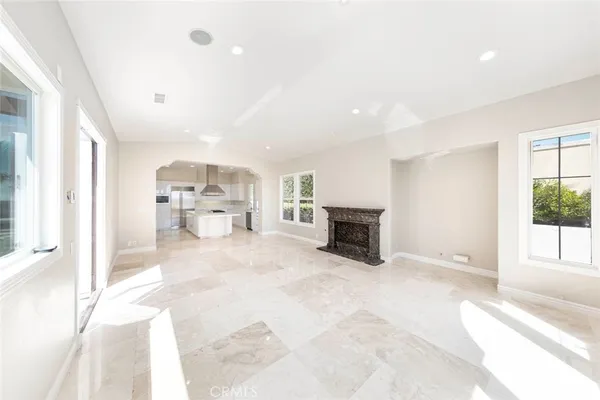 a view of kitchen with furniture and natural light