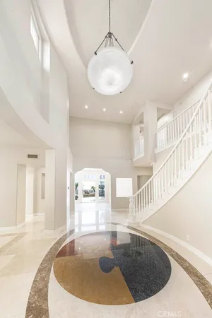 a view of a living room and chandelier