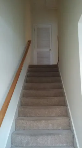 a bathroom with a toilet and a bath tub