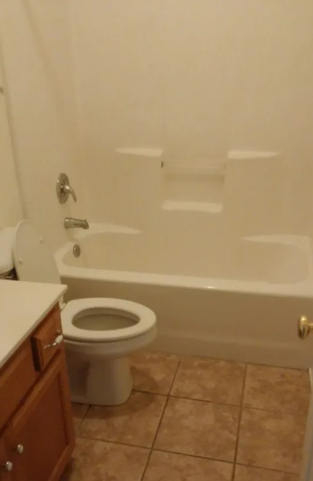207 Dakota Drive Spring Hill, TN 37174 - Photo 10 of 10 a bathroom with a toilet and a bath tub