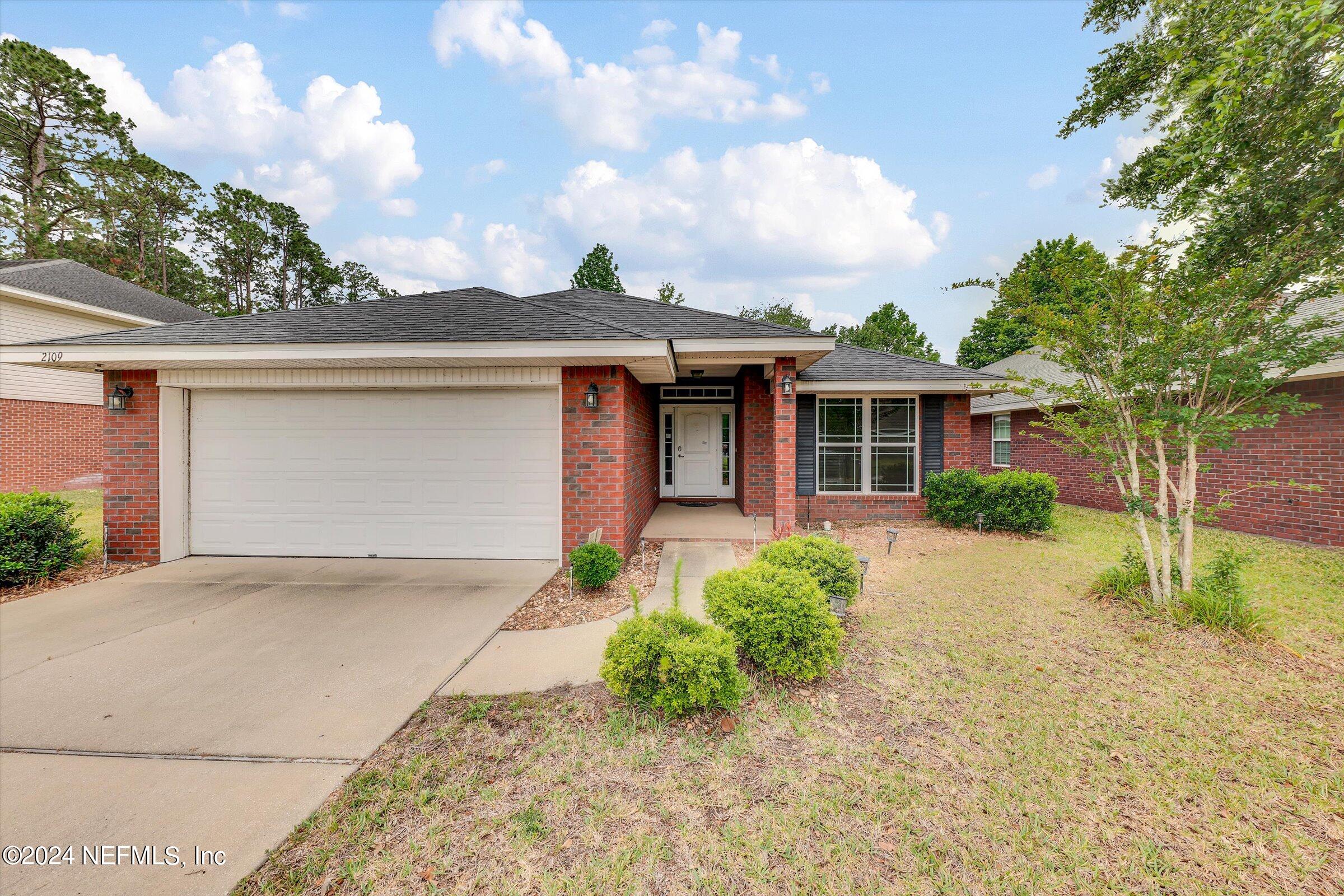 front view of a house with a yard