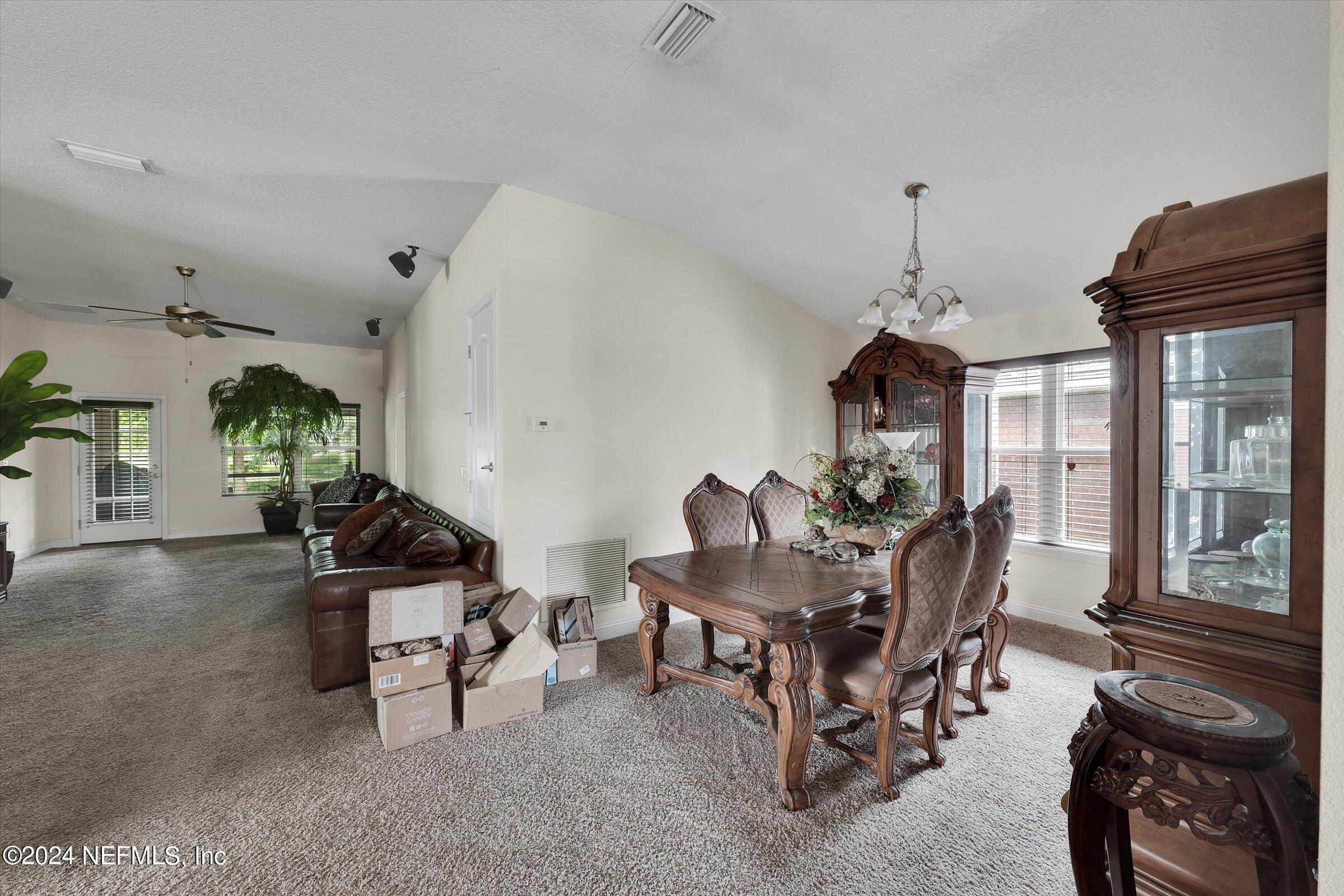 2109 Cherokee Cove Trail Jacksonville, FL 32221 - Photo 12 of 29 a living room with furniture and a window