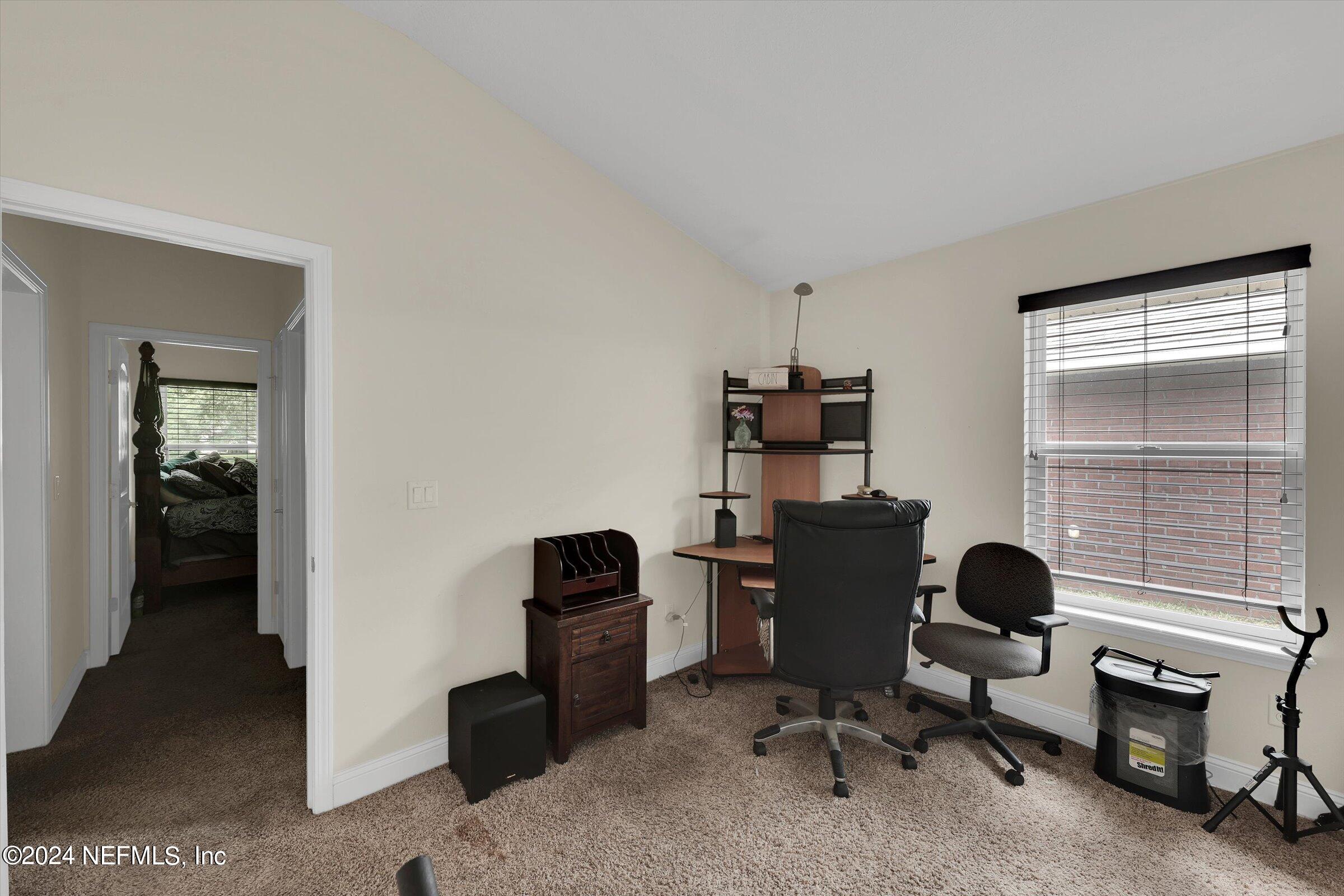2109 Cherokee Cove Trail Jacksonville, FL 32221 - Photo 16 of 29 a view of a workspace with furniture and a window