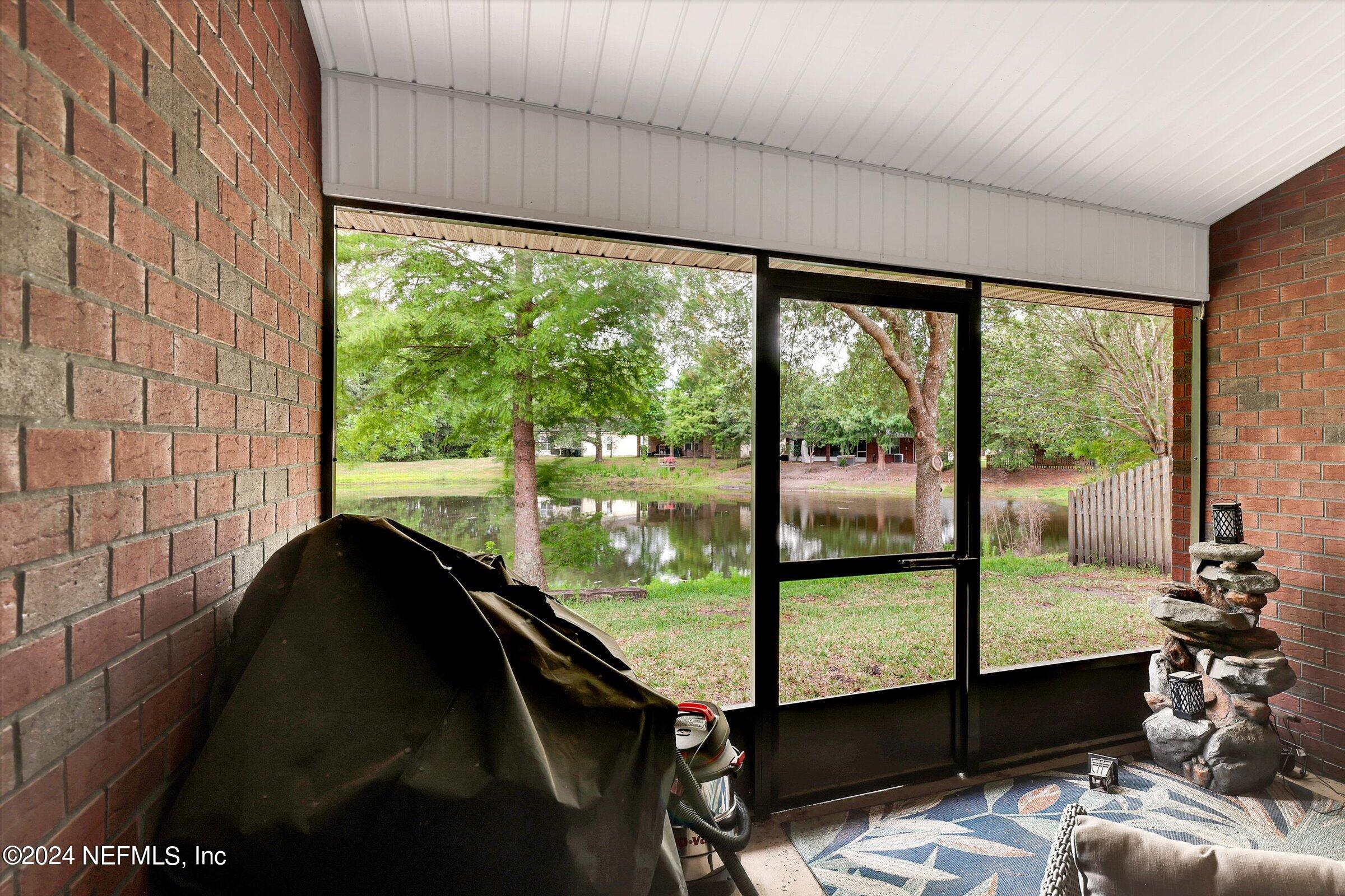 2109 Cherokee Cove Trail Jacksonville, FL 32221 - Photo 19 of 29 a living room with a large window