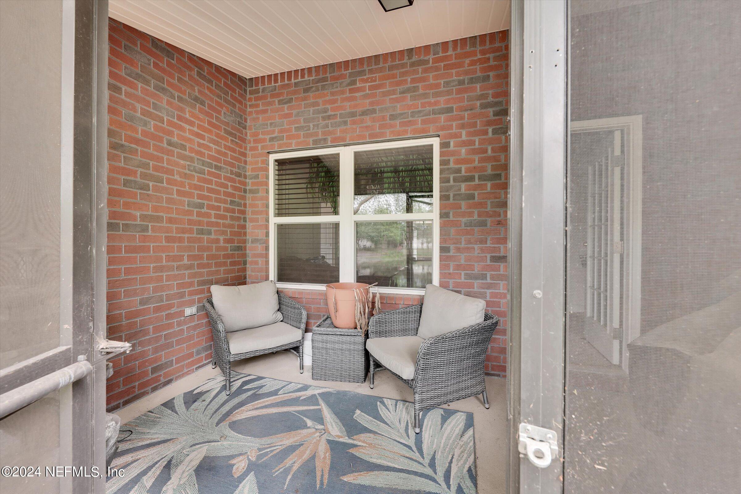 2109 Cherokee Cove Trail Jacksonville, FL 32221 - Photo 20 of 29 a balcony with couple of chairs and a potted plant