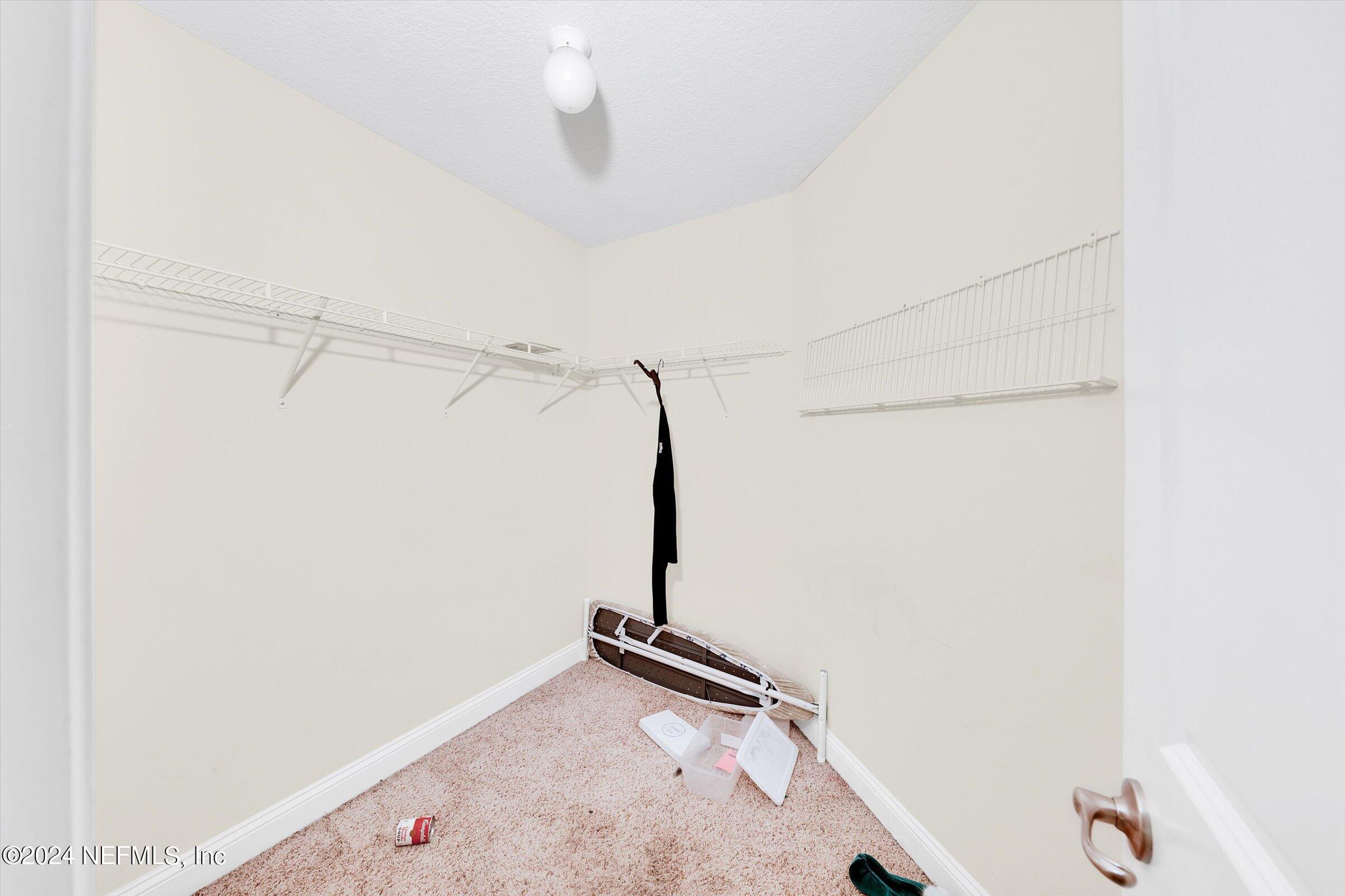 2109 Cherokee Cove Trail Jacksonville, FL 32221 - Photo 26 of 29 a view of a room with rack on the wall