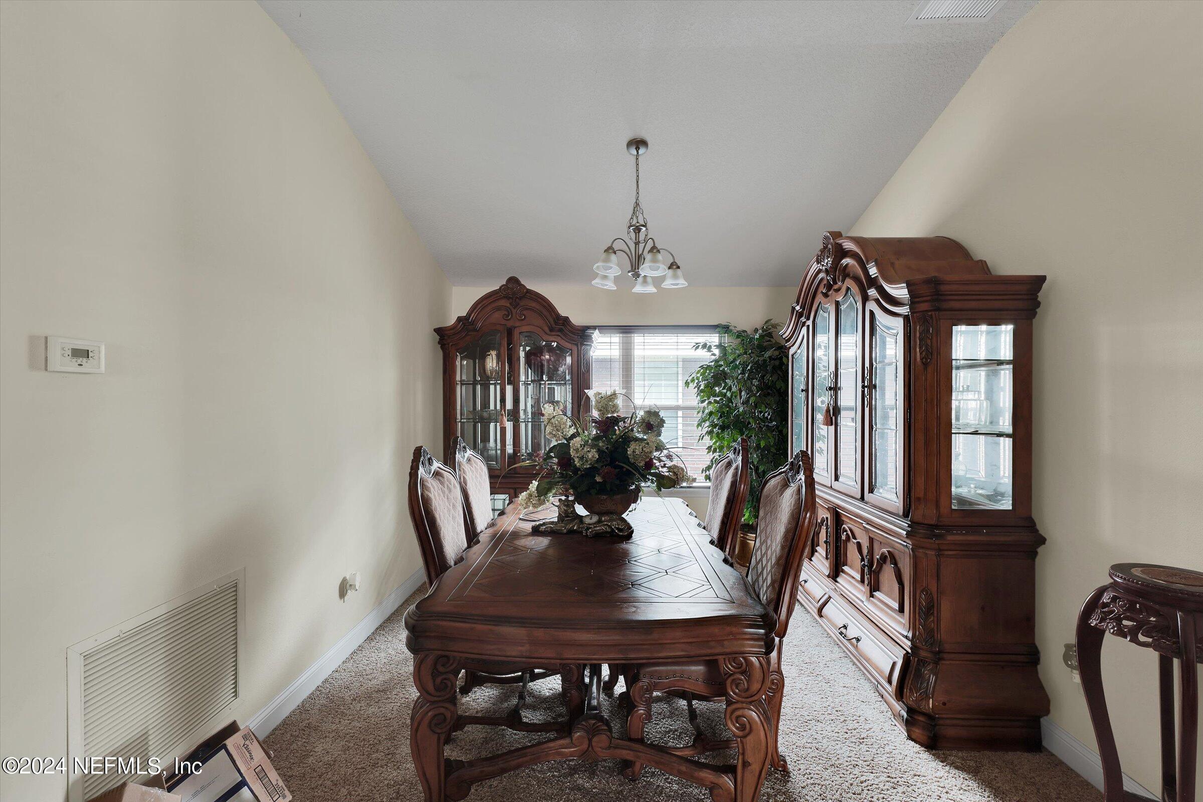 2109 Cherokee Cove Trail Jacksonville, FL 32221 - Photo 10 of 29 a view of a dining room with furniture and window